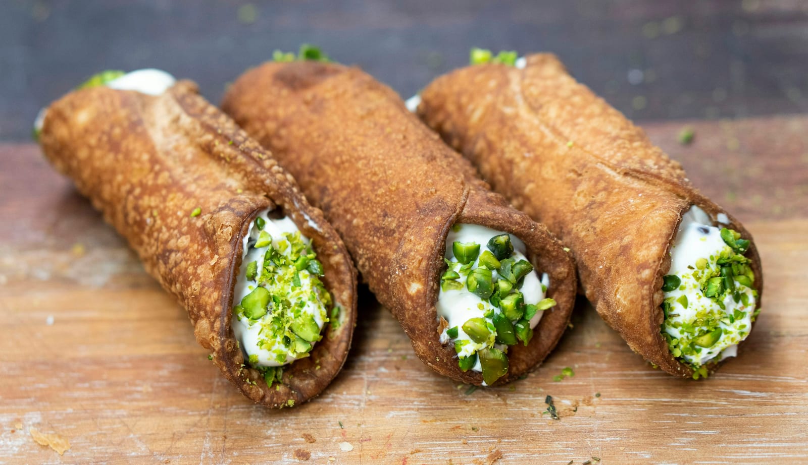 Italian cannoli with ricotta filling on a bakery tray