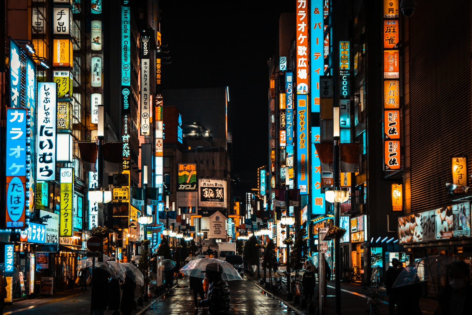 Neon-lit Shinjuku street at night