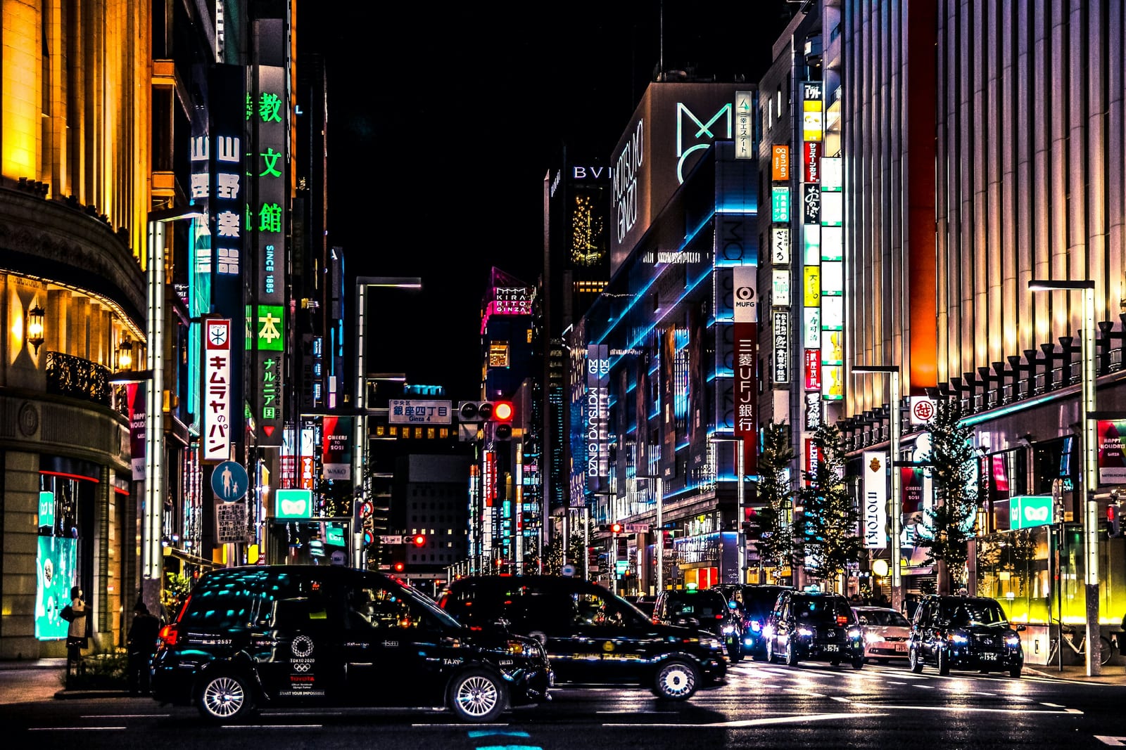 The Ginza 4-chome crossing lit up at night.