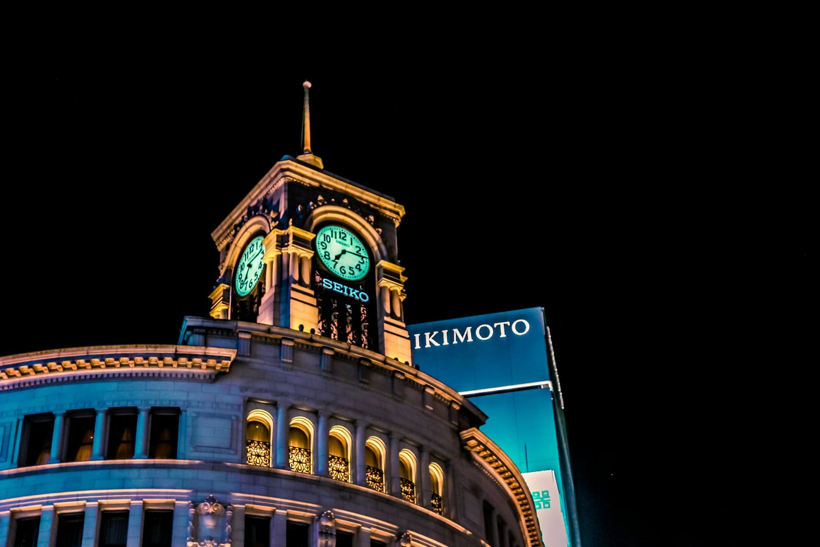 The illuminated Wako clock tower at the Ginza 4-chome crossing