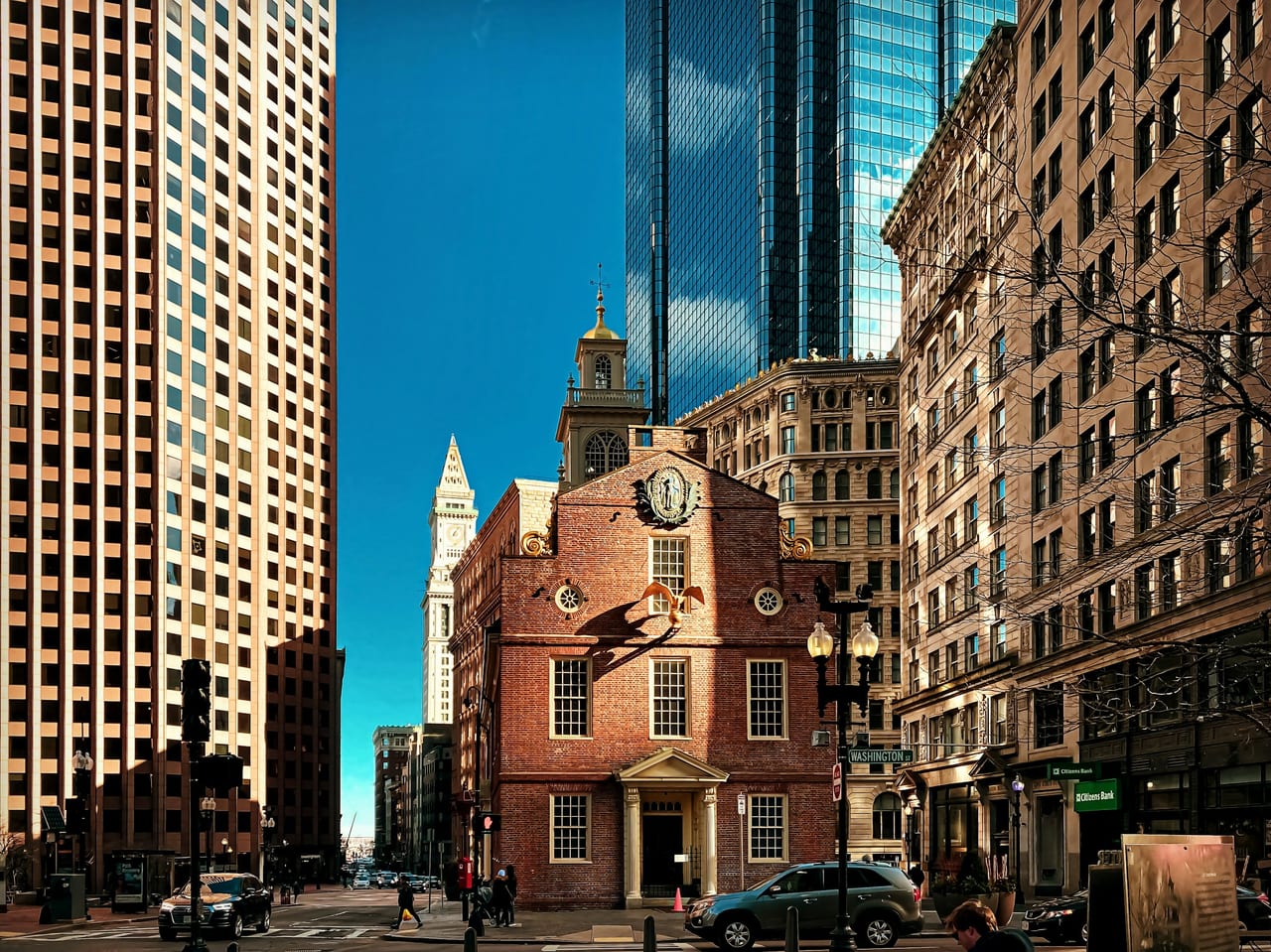 The red-brick Freedom Trail line winds past historic buildings in downtown Boston.