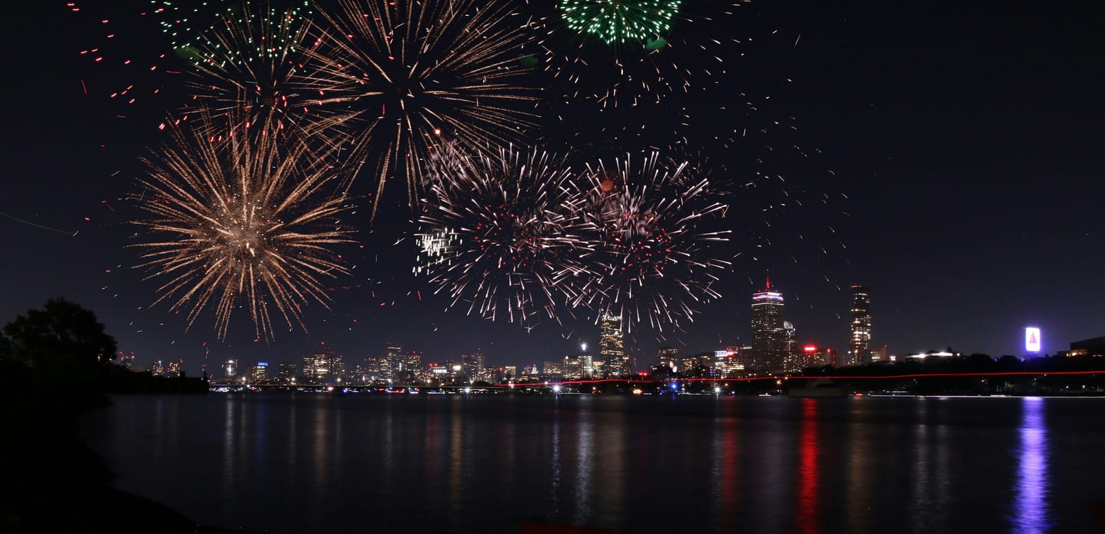 Fireworks over the Charles River and the Hatch Shell on July 4th in Boston.