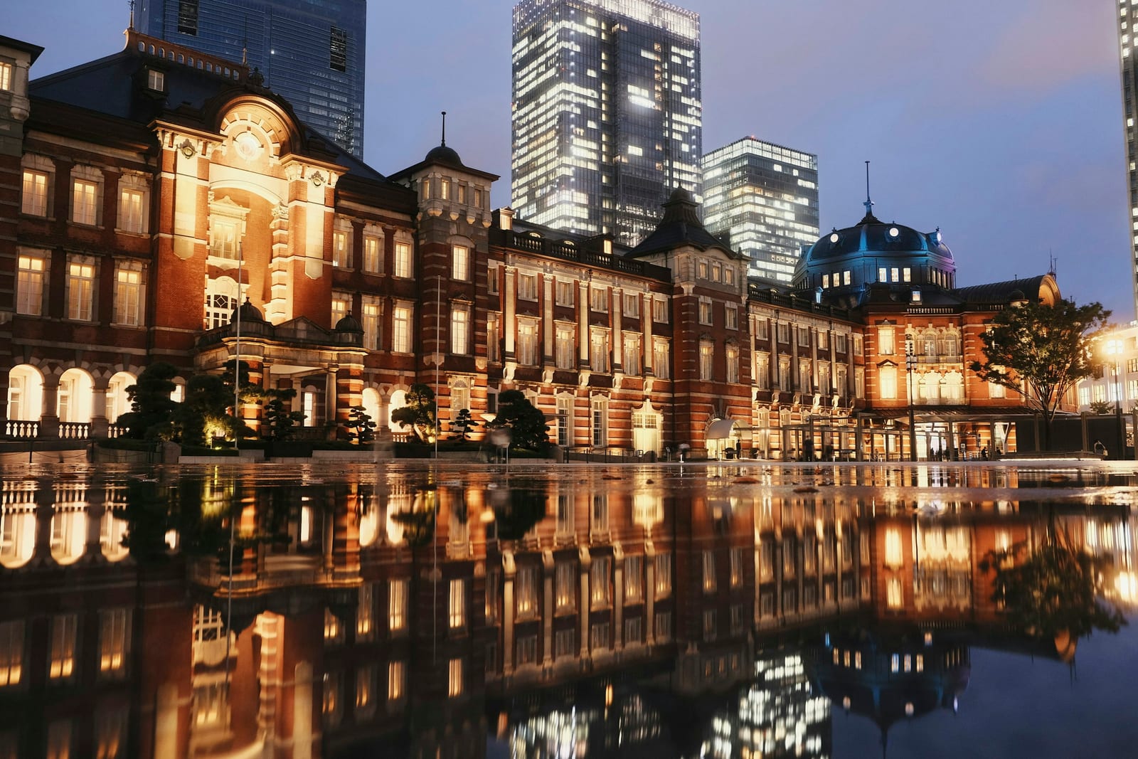 Tokyo Station reflected in water at night