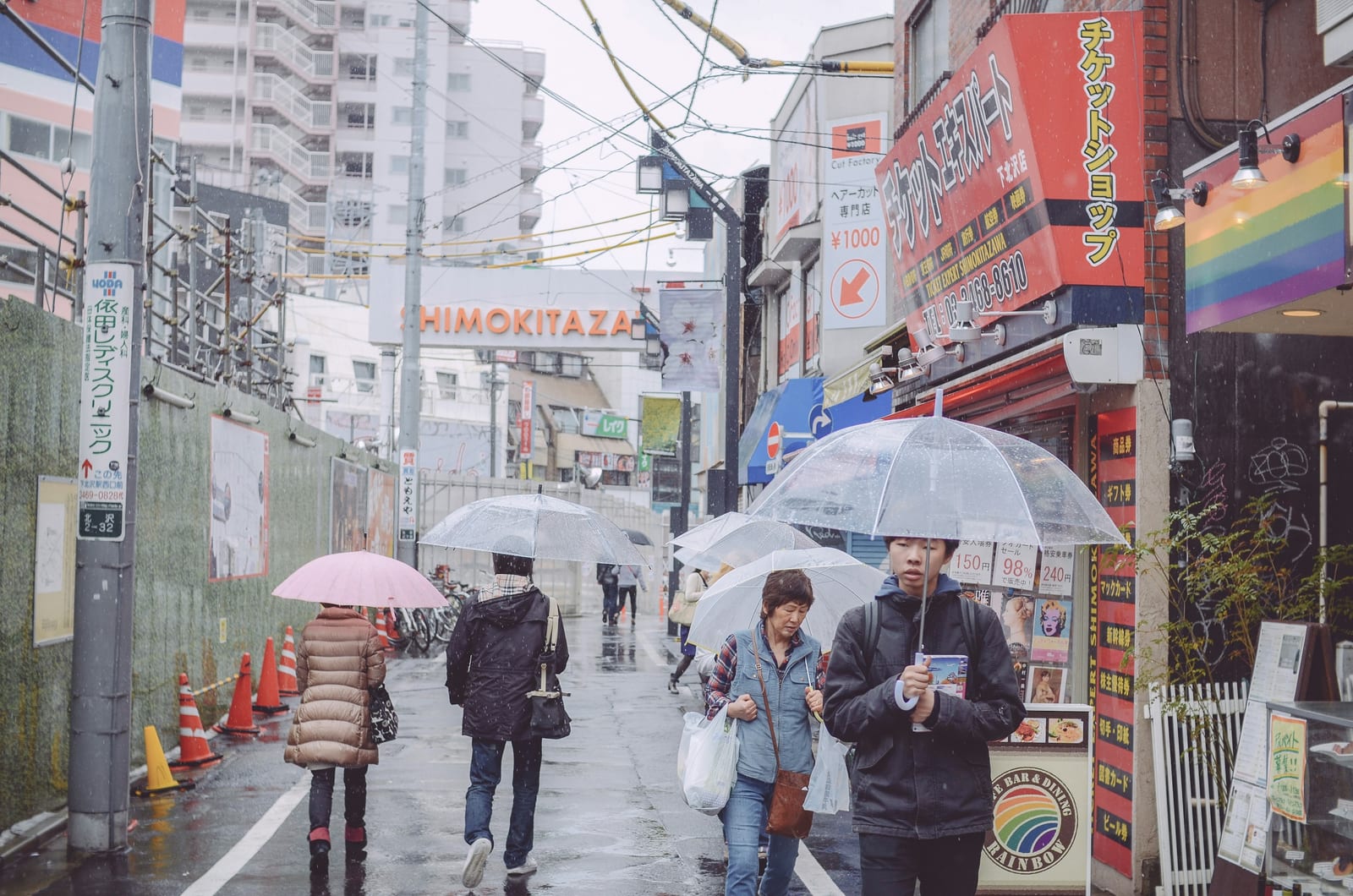 A busy Shimokitazawa street, the district's sign overhead