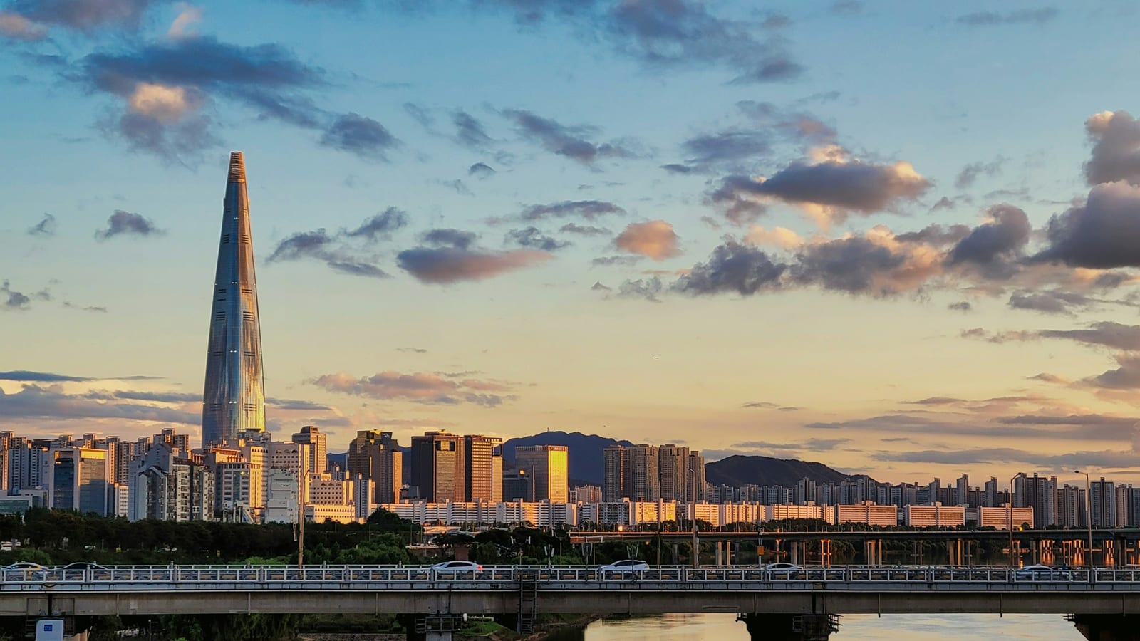 A city skyline with a bridge
