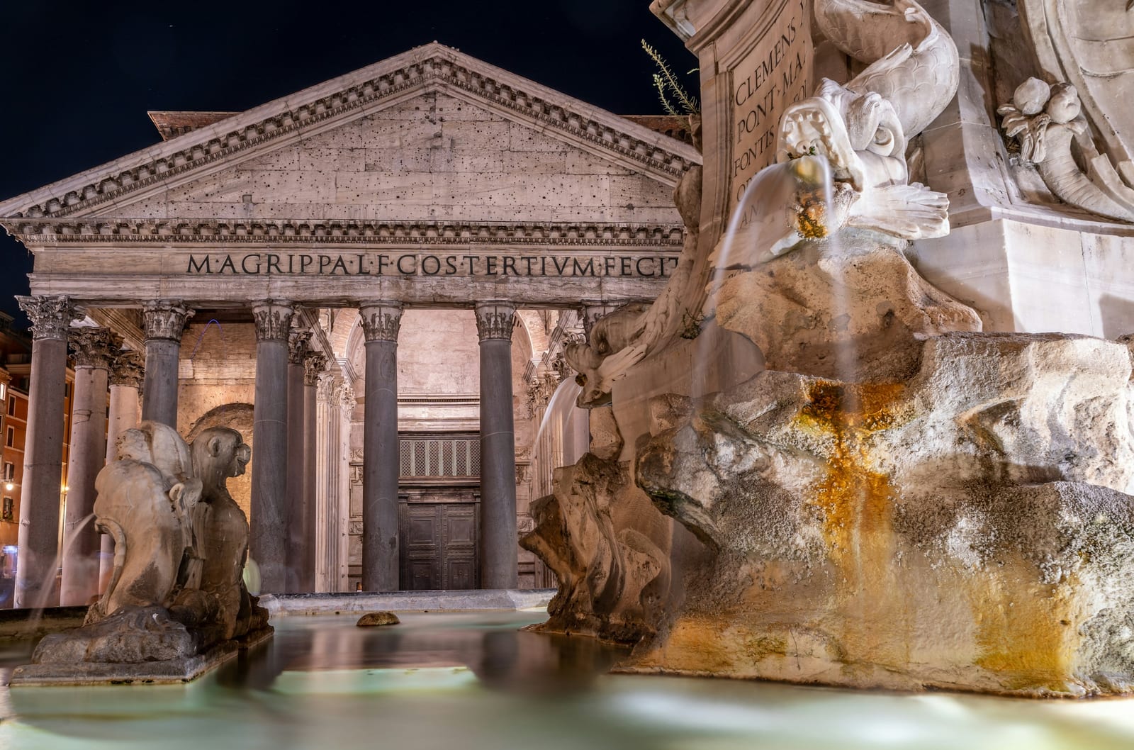 The portico of the Pantheon above the fountain in Piazza della Rotonda.
