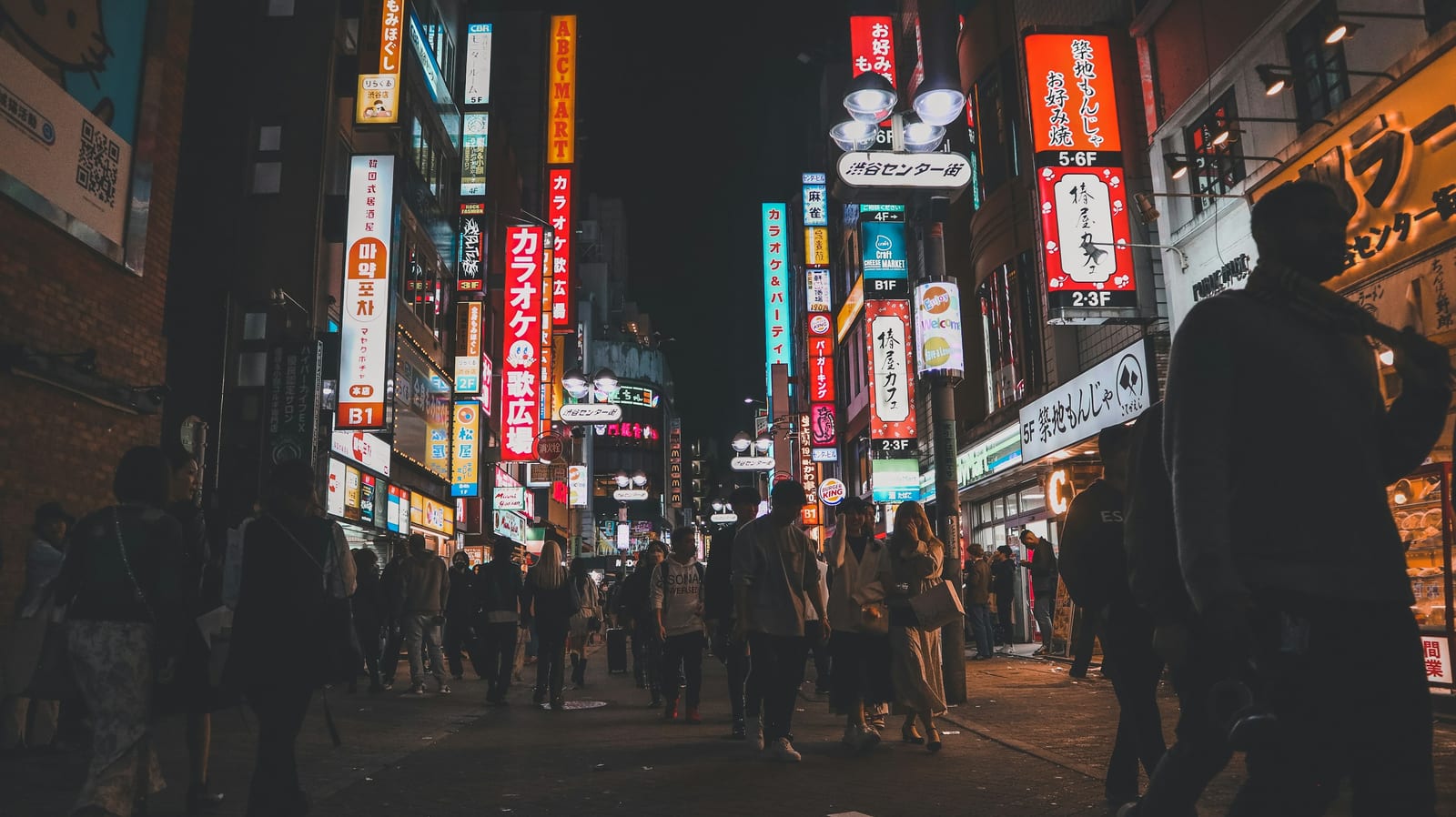 The neon signs lining Shibuya Center Gai.