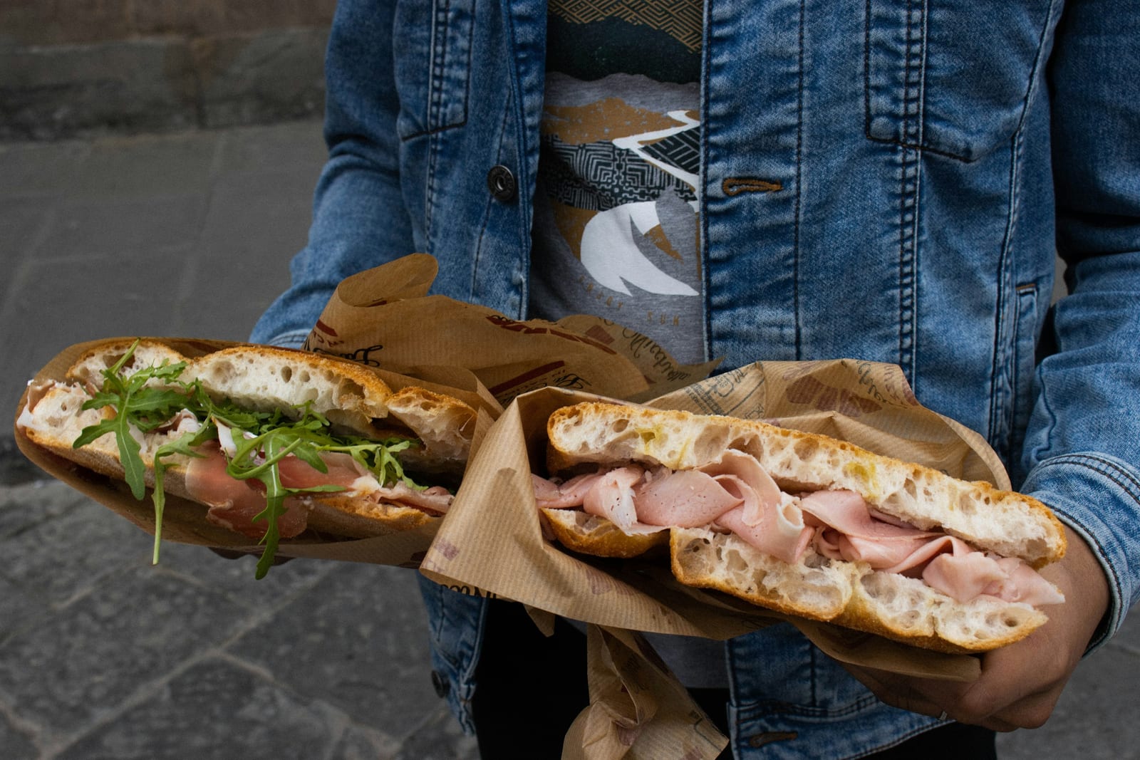 A crusty panino stuffed with slow-cooked braised beef and greens at Mordi e Vai in the Testaccio market.