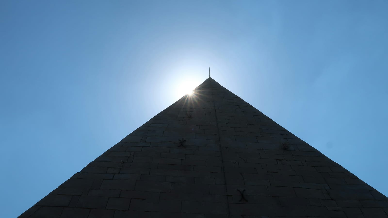 The ancient Pyramid of Cestius rising above the trees in Testaccio.