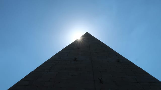 The ancient Pyramid of Cestius rising above the trees in Testaccio.