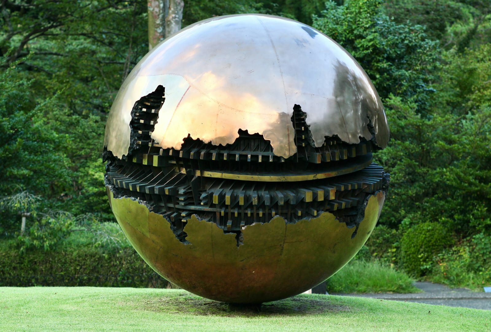 A mirror-finished sphere sculpture on the lawn of the Hakone Open-Air Museum.