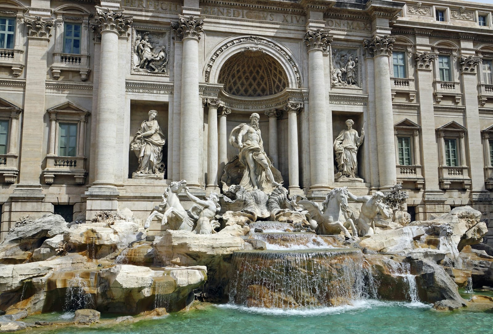 The white marble figures and basin of the Trevi Fountain.