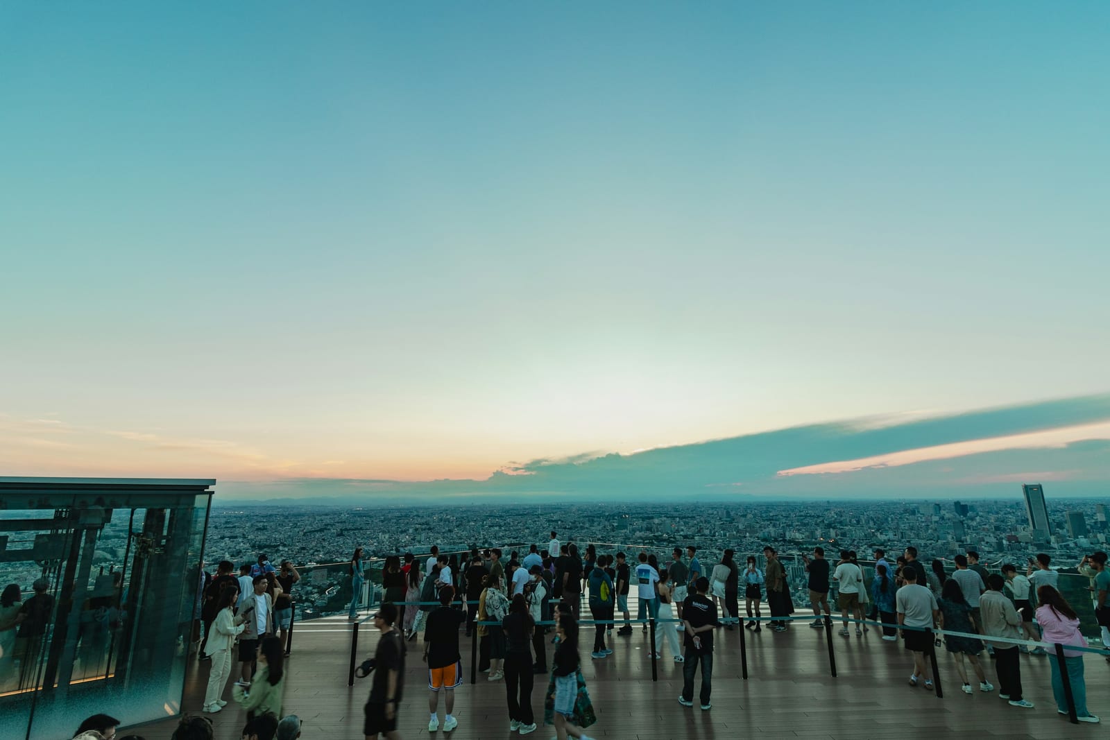 Visitors on the open-air rooftop deck of Shibuya Sky.