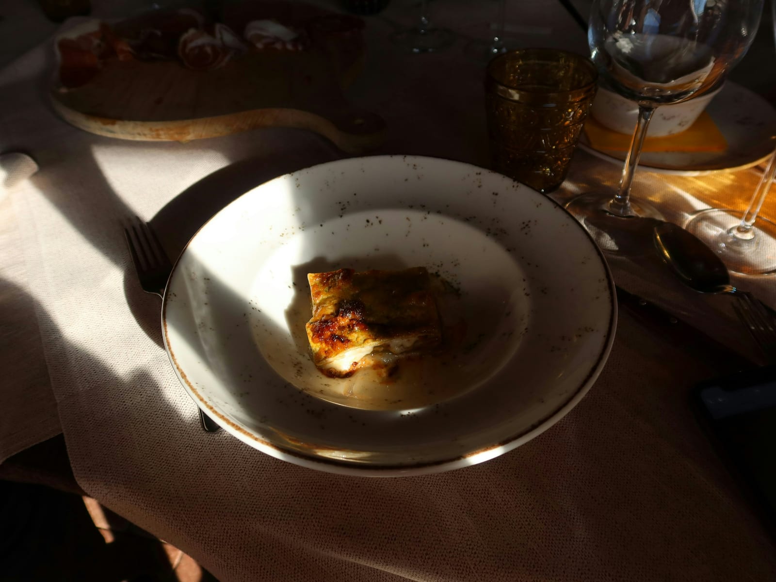 A plated Roman dish with tomato and cheese at Felice a Testaccio.