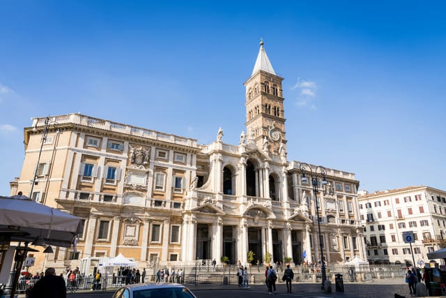 The baroque facade and bell tower of the basilica of Santa Maria Maggiore.