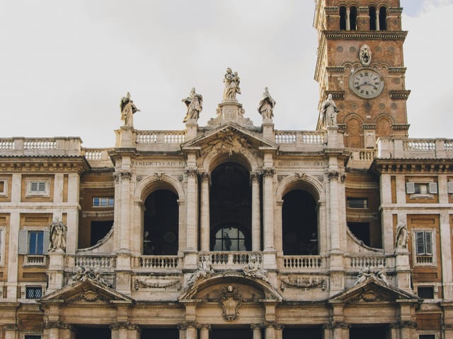 The baroque facade and bell tower of the basilica of Santa Maria Maggiore.