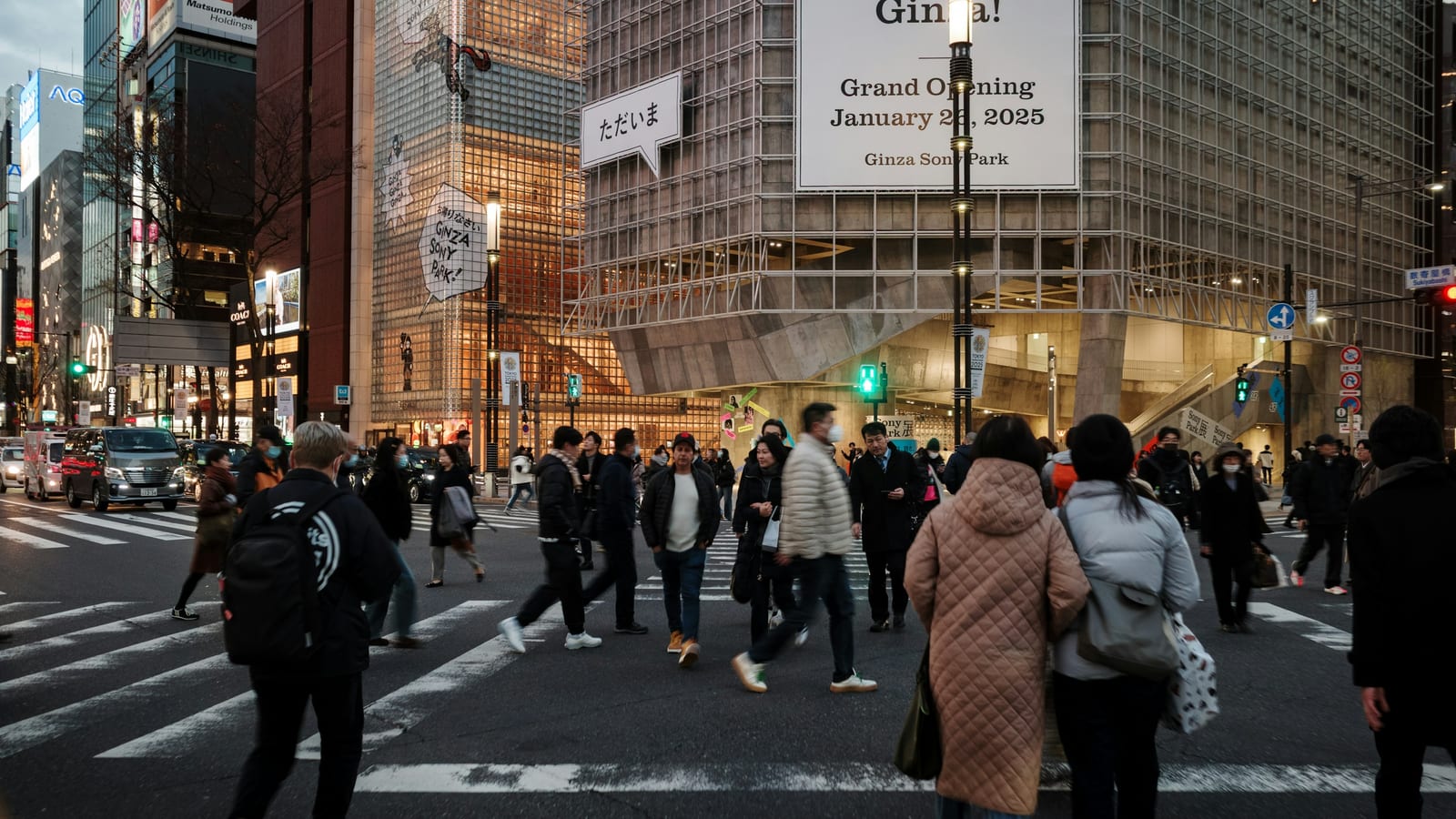 Shoppers crossing Chuo-dori in front of Ginza's department stores.