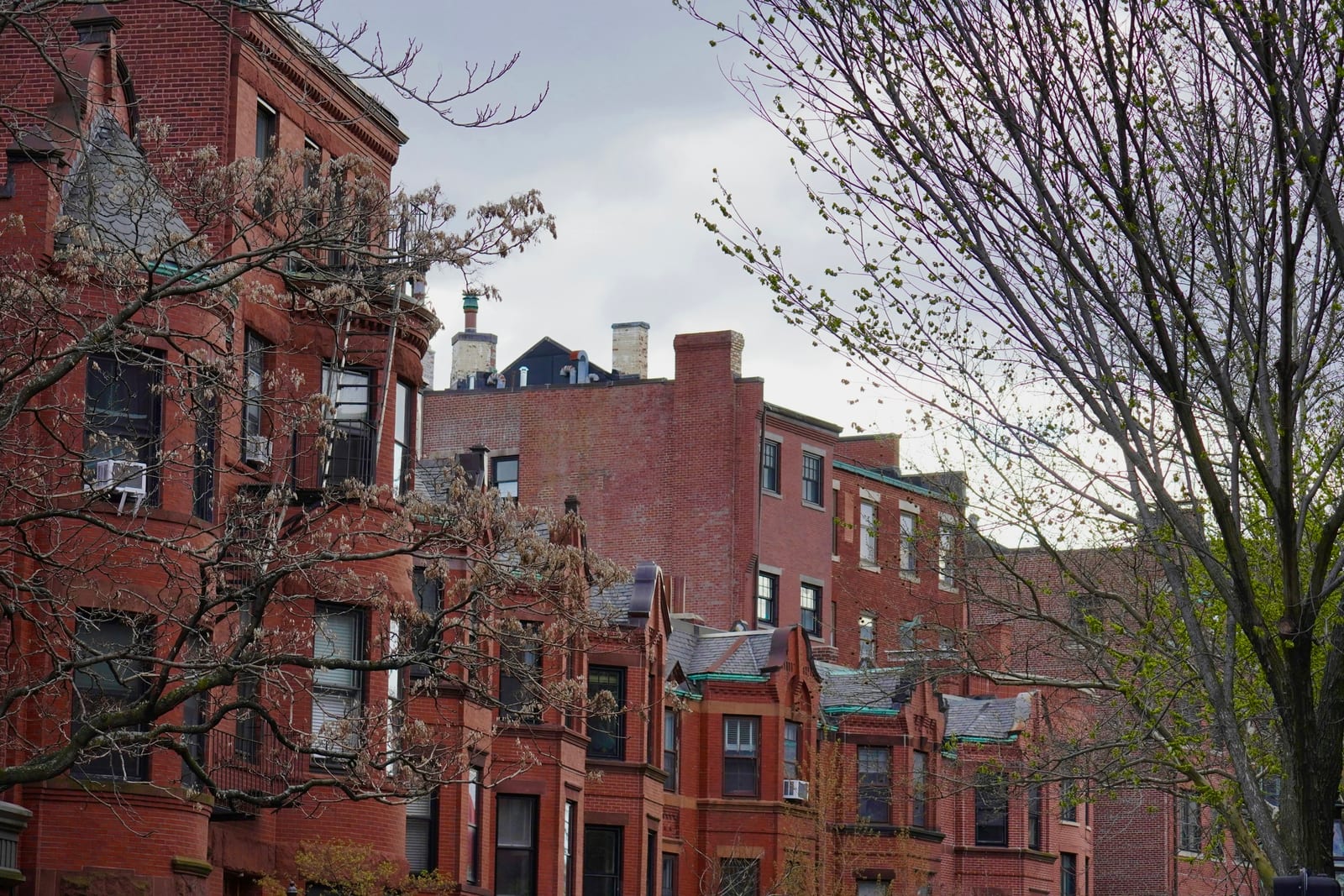 Historic flat-front brick townhouses on Beacon Hill near Louisburg Square.