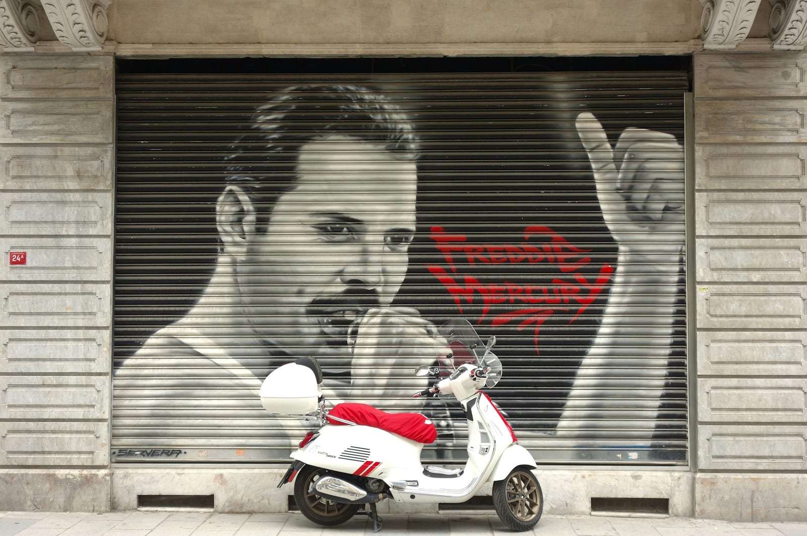 A graffiti-covered shutter on a street in the San Lorenzo quarter.
