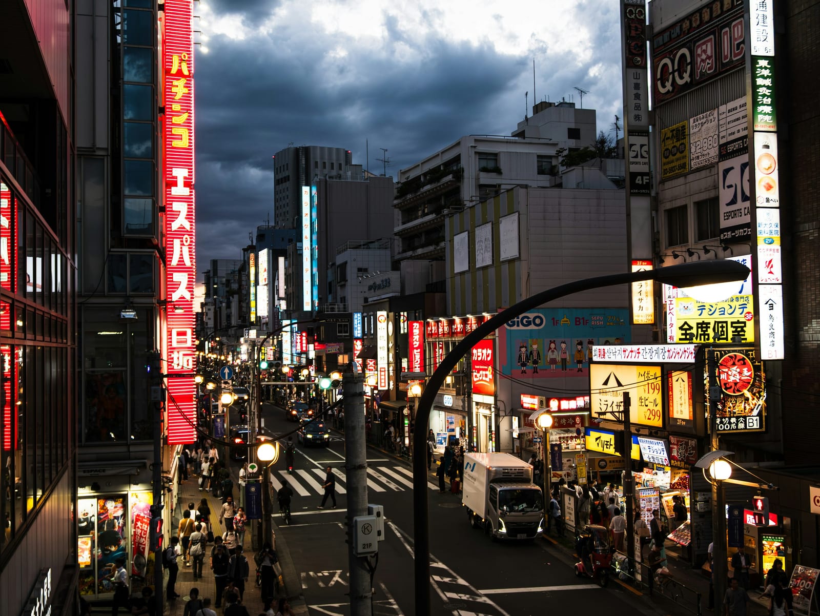 A neon-lit Akihabara street at night