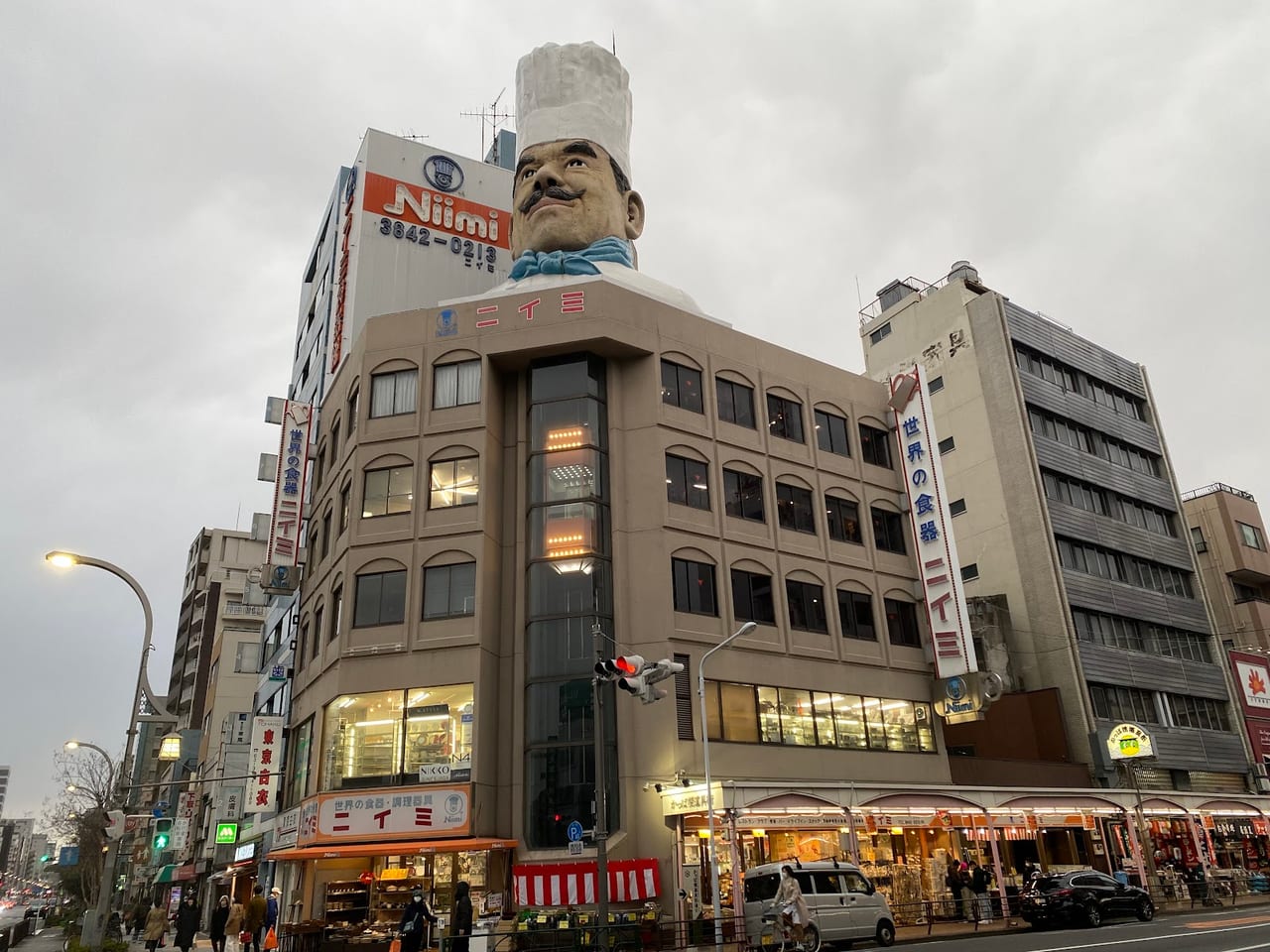 A giant chef's-head bust crowns the Niimi building at the entrance to Kappabashi, Tokyo's kitchen-supply street.