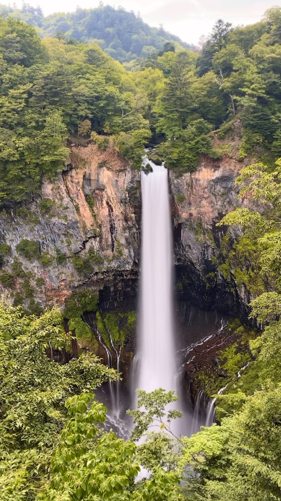 Kegon Falls drops in a single white column down a forested cliff below Lake Chuzenji near Nikko.