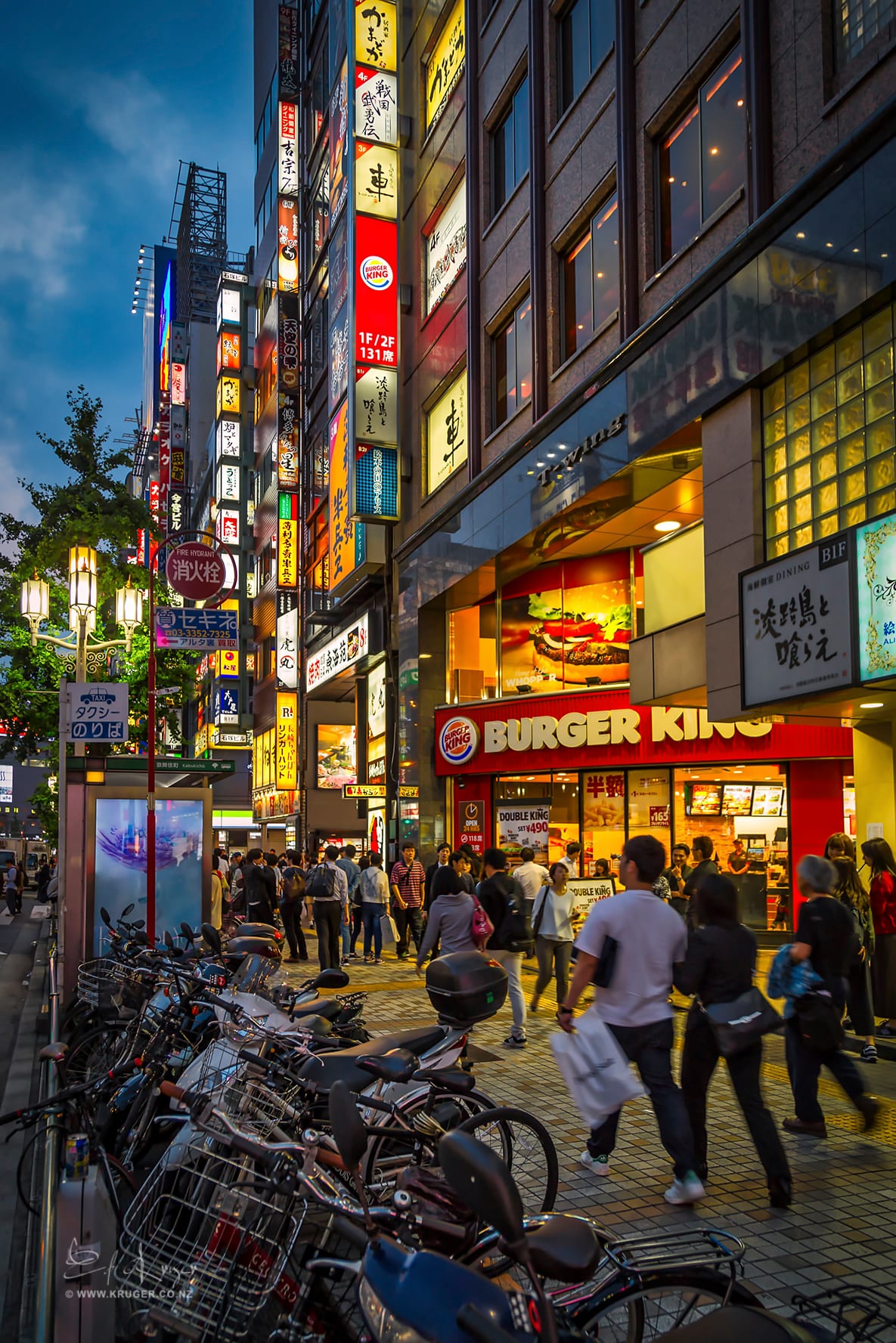 Neon-lit Shinjuku street at night